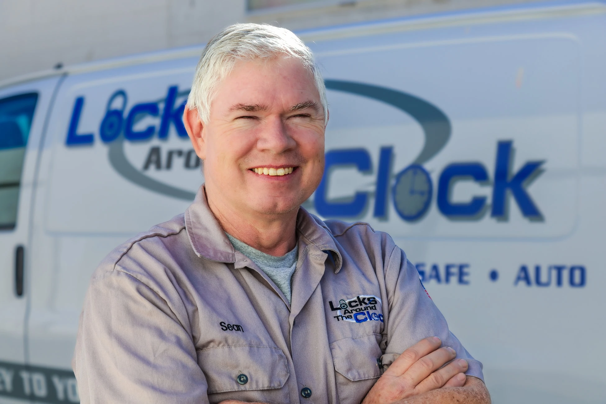 Sean Cahill, owner and master locksmith at Locks Around the Clock, in front of the branded service van